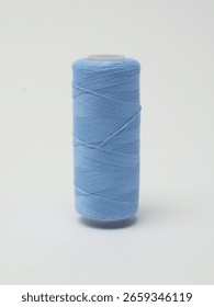 Spools of Sewing Thread on grey background