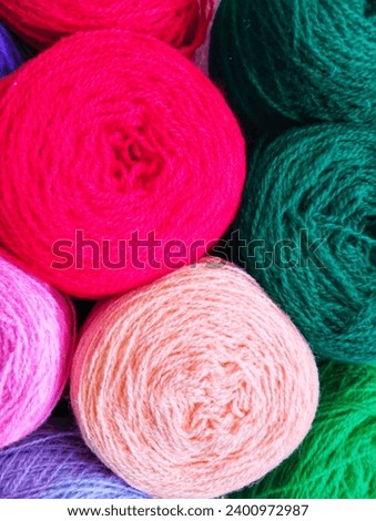spools of woolen thread of various colors 