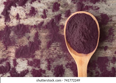 Spoon With Acai Powder On Table