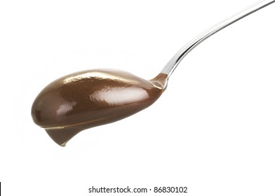 Spoon With Chocolate Pudding Close Up On White Background