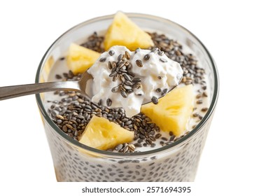 A spoon with cottage cheese, pineapple slices and Chia seeds