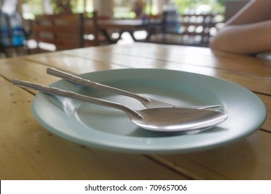 Spoon and fork on dish
