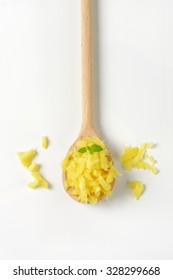 Spoon Of Freshly Grated Ginger On White Background