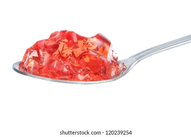 A Spoon Full Of Red Gelatin. On A White Background.