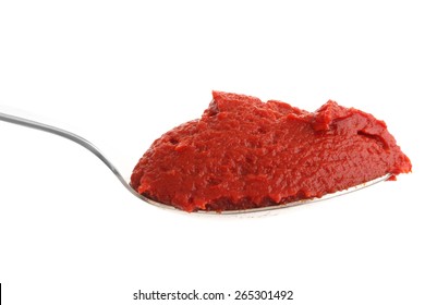 Spoon Full Of Tomato Paste On White Background.