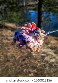 Spoon With Healthy Breakfast Overnight Oats With Strawberries, Blueberries With Outdoor Background - Food Prep And Meal Prep Concept