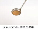  spoon isolated on white background. chicken stock on spoon.