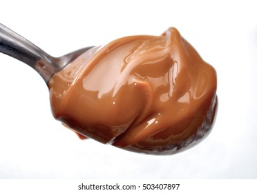 A Spoon With Milk Caramel Spread Better Nown As Dulce De Leche.
