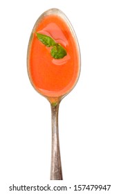 Spoon With Red Tomato Cream Soup And Green Basil In Vertical Format