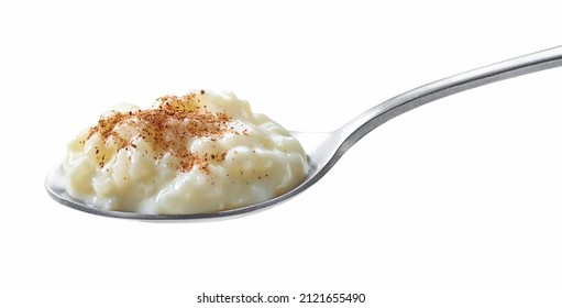 Spoon Of Rice Milk Pudding With Cinnamon Isolated On White Background