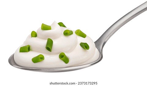 Spoon of sour cream with green onion isolated on white background, full depth of field