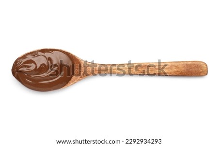 Spoon with tasty chocolate paste on white background, top view