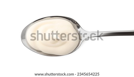 Spoon with tasty mayonnaise isolated on white, top view