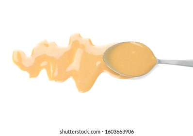 Spoon With Tasty Tahini On White Background