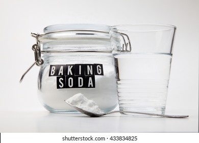 Spoonful Of Baking Soda And Glass Of Water