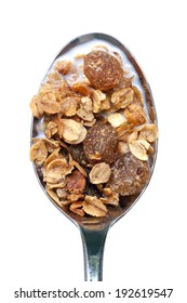 Spoonful Of Breakfast Cereal With Milk, Isolated On White Background.  Overhead View.