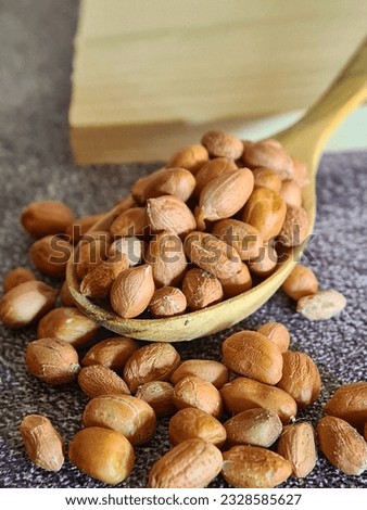 A spoonfull of peanut on the table