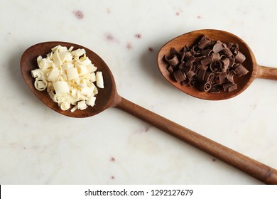 Spoons With Different Chocolate Curls On Light Background, Top View