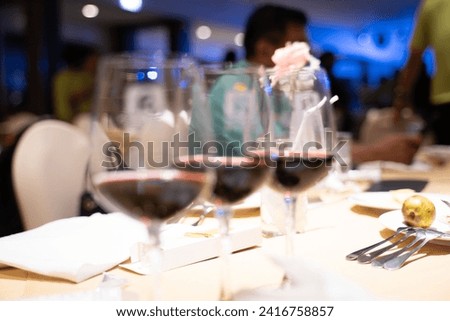 Spoons lined up on a dining table in a hotel banquet.