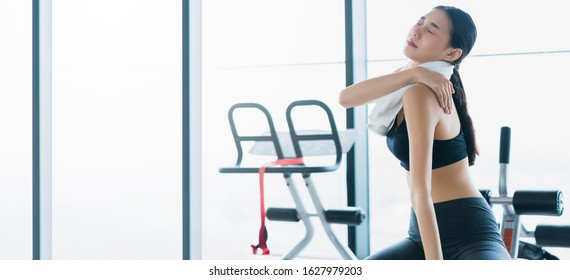 Sport Accident Concept Body Hurt In Gym Asian Female Hand Touch Body Part With Pain From Wrong Action Workout In Fitness Gym