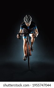 Sport. Athlete cyclists in silhouettes on dark background