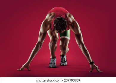 Sport. Athlete runner in silhouettes on red background - Powered by Shutterstock