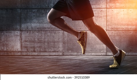 Sport background, close up of urban runner's legs run on the street with copy space - Powered by Shutterstock