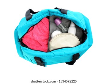 Sport Bag With Deodorants And Clothes On White Background, Top View