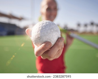 Sport, ball in hand and hockey on field with athlete and fitness outdoor for training on stadium turf. Hockey player, workout and sports closeup, field hockey and active with healthy lifestyle. - Powered by Shutterstock