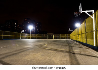 Sport basketball court at night.