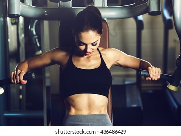 Sport. Beautiful woman in gym - Powered by Shutterstock