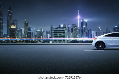 Sport Car On Roadside With Night Scene Near The Modern City Background .