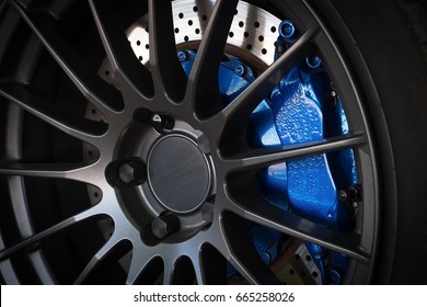 Sport car wheel and blue brake caliper
