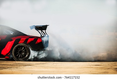 Sport car wheel drifting. Blurred of image diffusion race drift car with lots of smoke from burning tires on speed track. Sport concept,Drifting car concept
