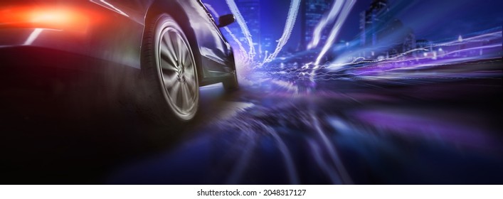 Sport car wheel drifting on night of city lighting background