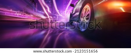 Sport car wheel drifting on night of city lighting background