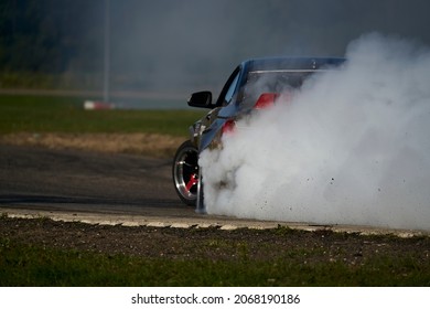 sport car wheel drifting and smoking on track dark edition