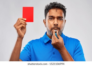 Sport, Caution, Game And Football Concept - Indian Referee Whistling And Showing Red Penalty Card