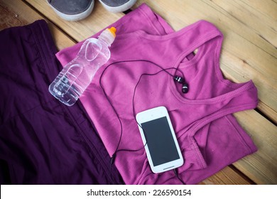 Sport clothes, shoes and headphones - Powered by Shutterstock