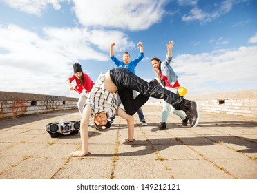 sport, dancing and urban culture concept - group of teenagers dancing - Powered by Shutterstock