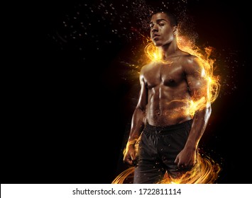 Sport. Dramatic portrait of professional athlete. Winner in a competition. Fire and energy.