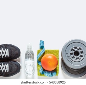 Sport Equipment On White Background, Top View. Concept Healthy Lifestyle, Healthy Food, Sport And Diet.