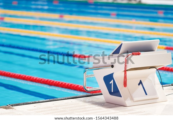 Sport facility. Swimming pool\
starting block No.1. Sport and swimming concept. Water\
sports