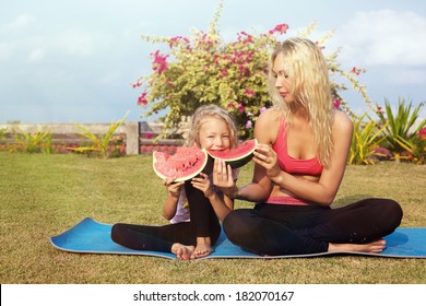 Sport Family Eating Watermelon At Park