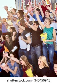 Sport Fans Hands Up Eating Popcorn  And Singing On Tribunes. Group People.