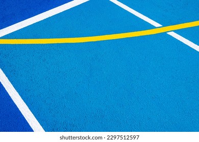 Sport field court background. Blue rubberized and granulated ground surface with white, yellow lines on ground. Top view - Powered by Shutterstock