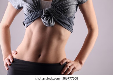 Sport, fitness, Dieting results, Healthy woman body, waistline. Slim female torso, waist, belly, abdomen close up.