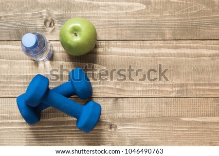Sport and fitness equipment, creative flat lay on wooden board. Space for you. Flat lay.