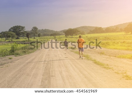 Sport fitness running Athletes, Father and sonin outdoor workout training for health and fitness. soft focus concept Landscape .
