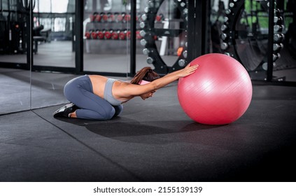 Sport Fitness Woman Wearing Sportwear With Headband Doing Pilates Exercise Her Pelvis With Fit Ball At Gym Is Individual Sport To Fit Muscles Of Body For Healthy Life Concept.